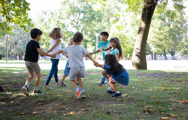 Children playing outdoors in a circle